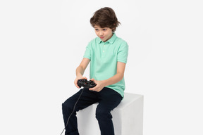 Focused boy playing video games