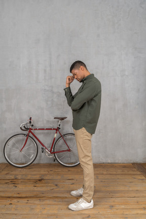 Side view of a man thinking hard and looking tired