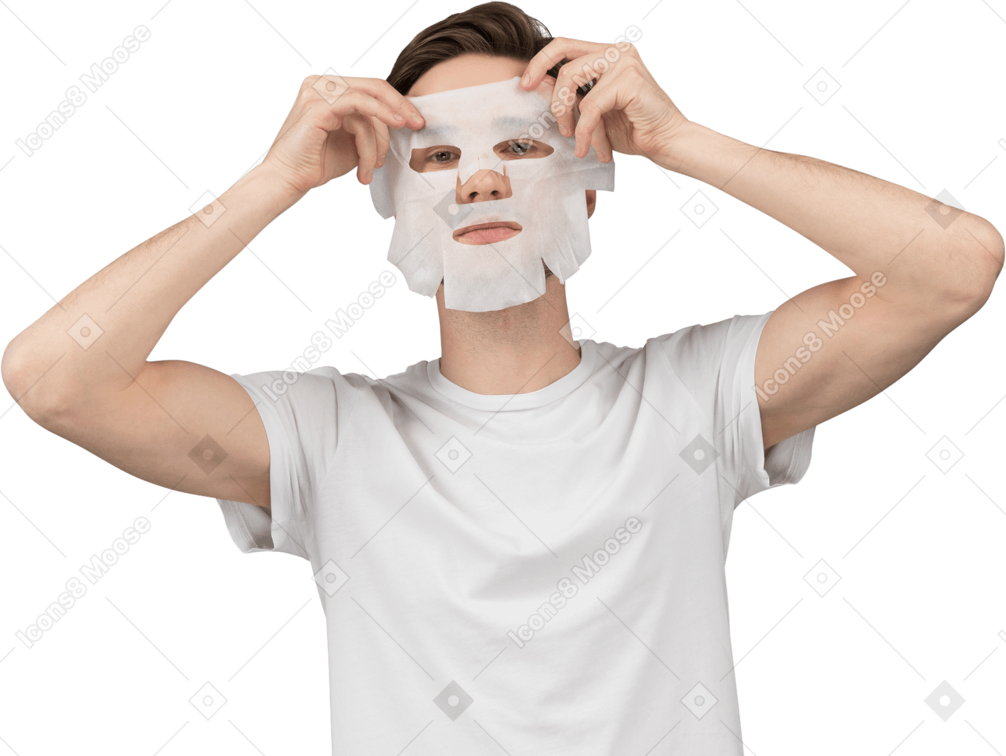 Front view of a young man putting on facial mask