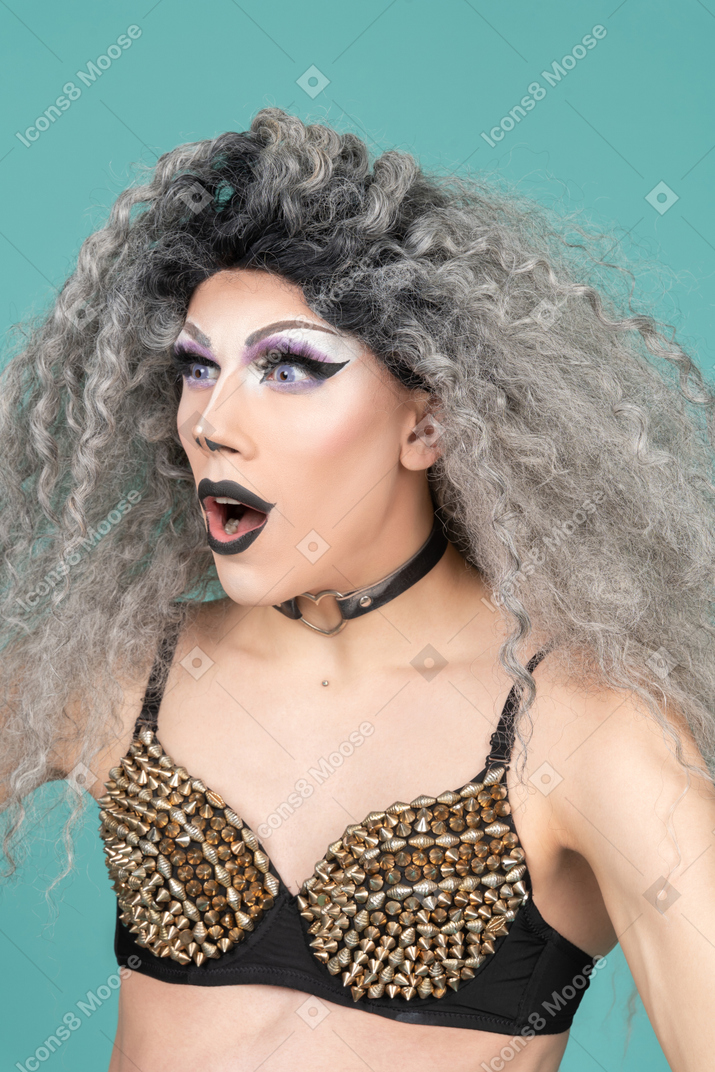 Close-up of a drag queen looking very surprised