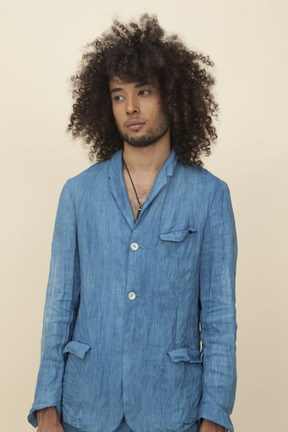 Afroman with big curly hair wearing denim suit