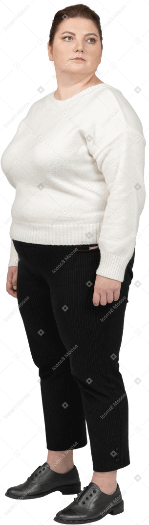 Plump woman in casual clothes standing