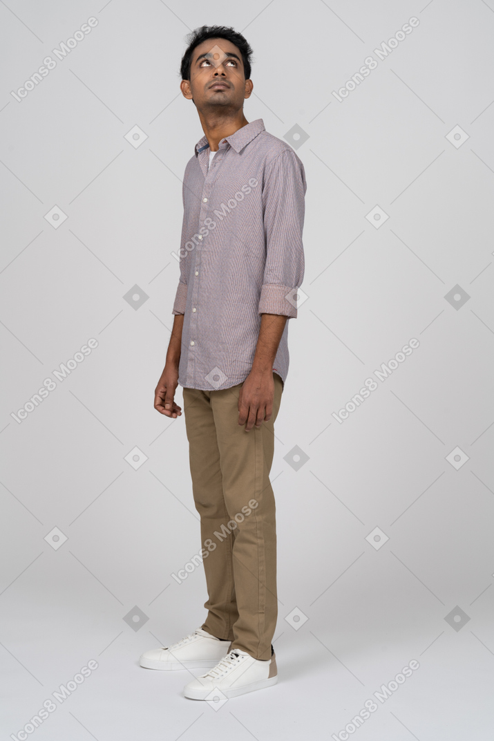 Young man in casual clothes standing