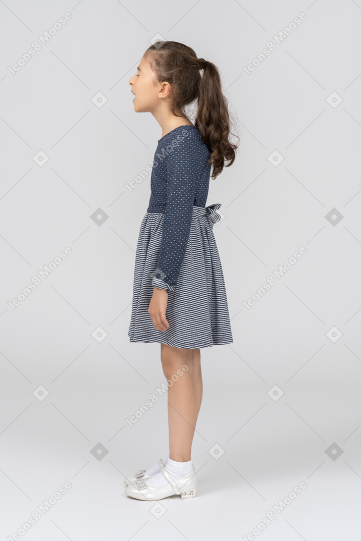 Side view of a girl in casual clothes with her eyes closed