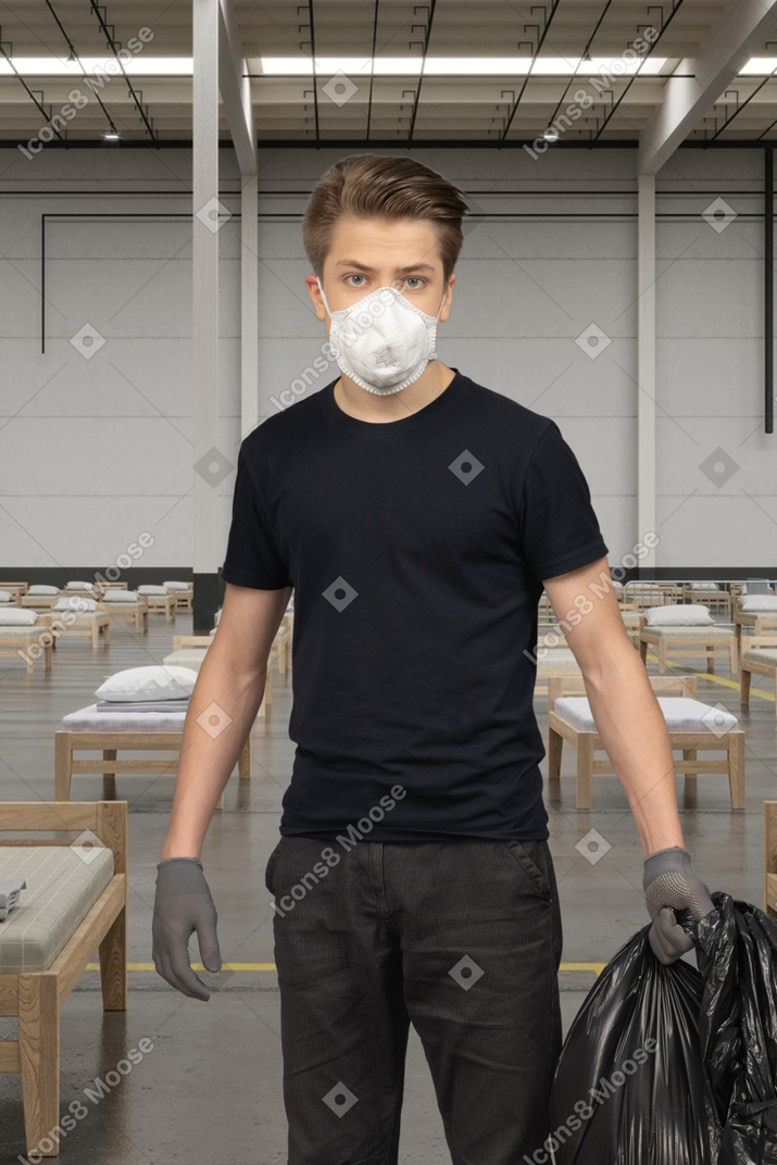 Young man working at a covid hospital