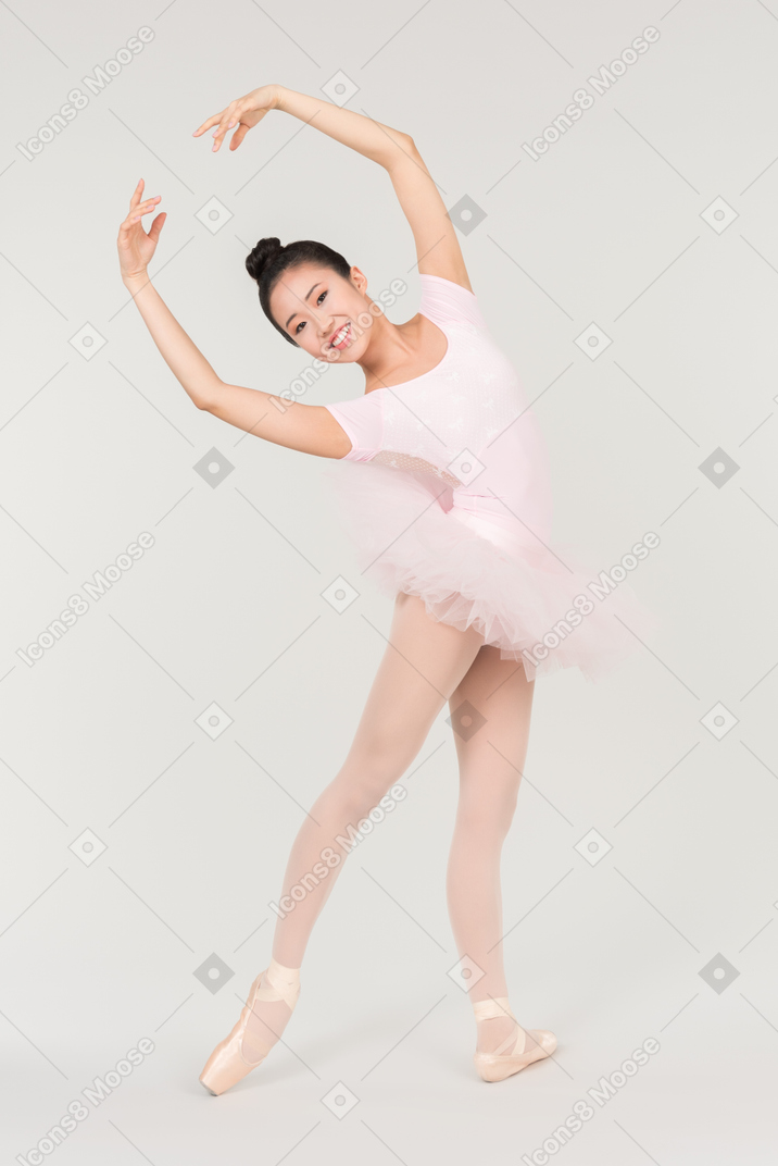 Young asian ballerina standing in ballet position