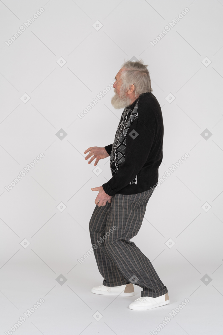 Side view of a scared elderly man