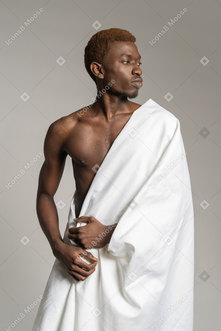Profile of a young man in white towel