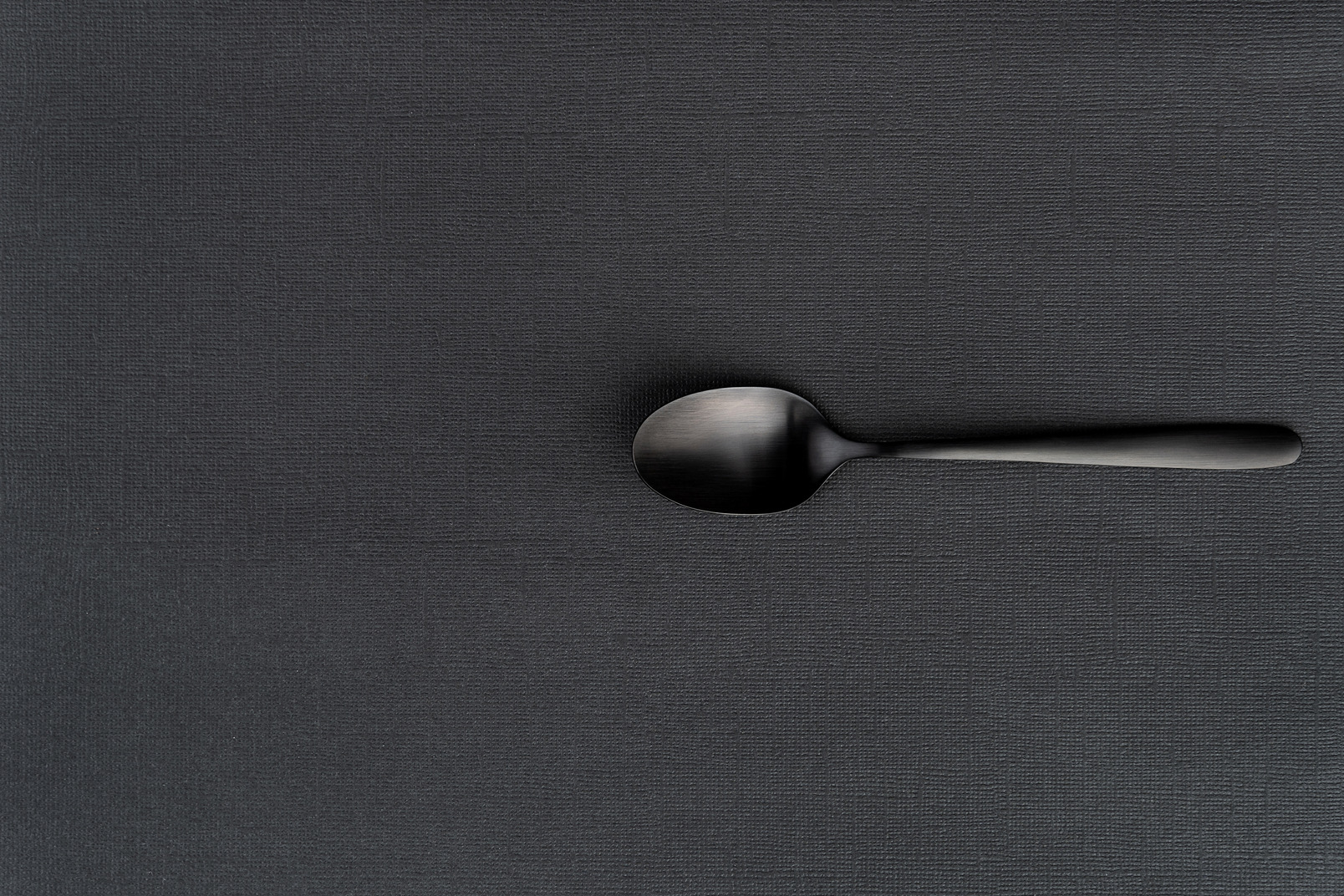 Black tea spoon in the dark