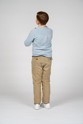 Boy standing back to camera