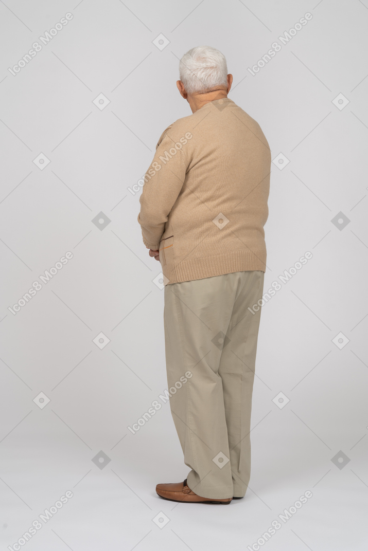 Rear view of an old man in casual clothes