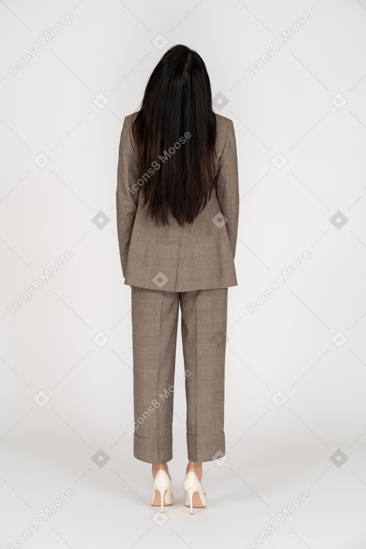 Back view of a young lady in brown business suit