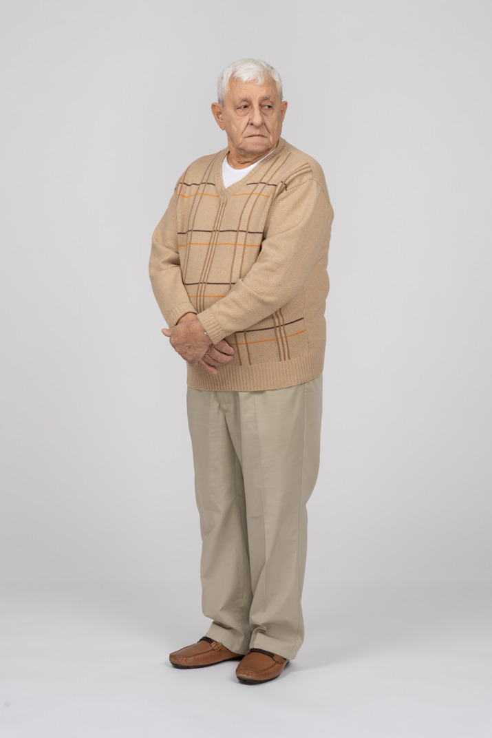 Front View Of An Old Man In Casual Clothes Looking Aside Photo