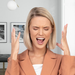 Woman screaming in a room