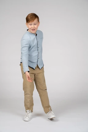 Front view of a boy looking at something with interest
