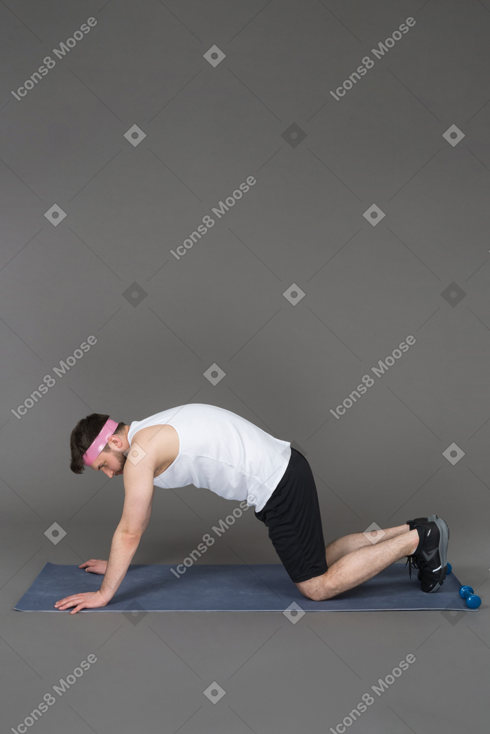 Sporty young man arching-out