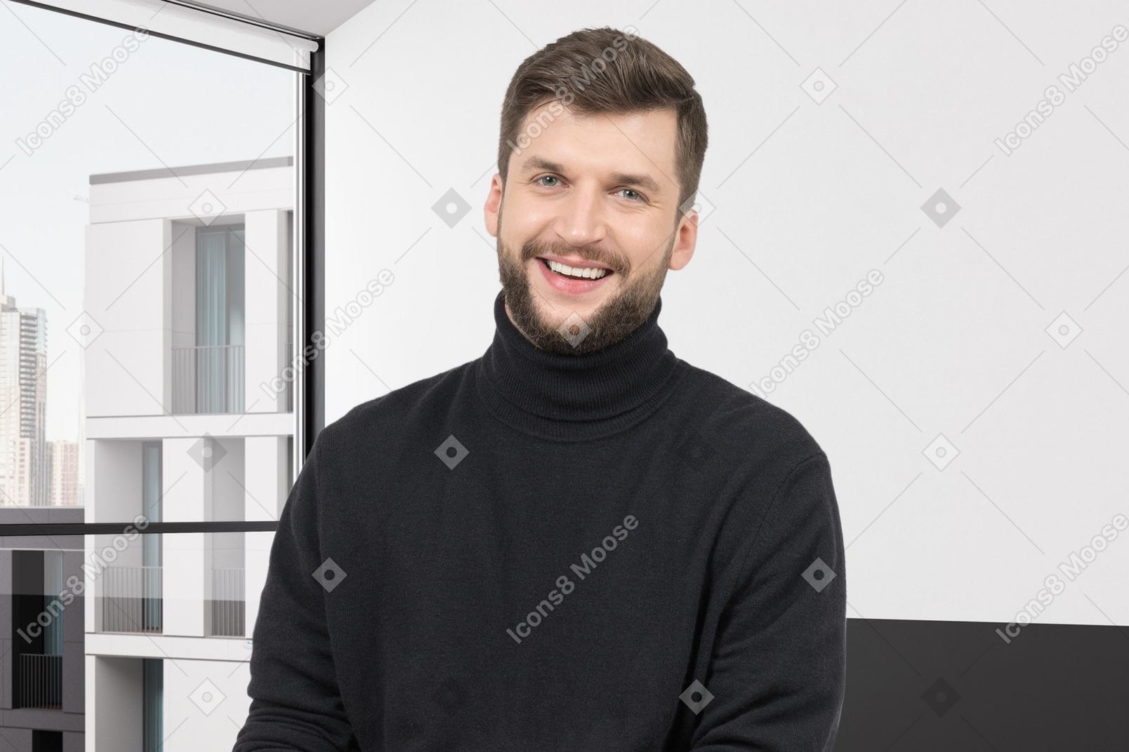 Smiling young man standing in a room