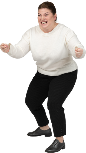 Angry plump woman in casual clothes fighting