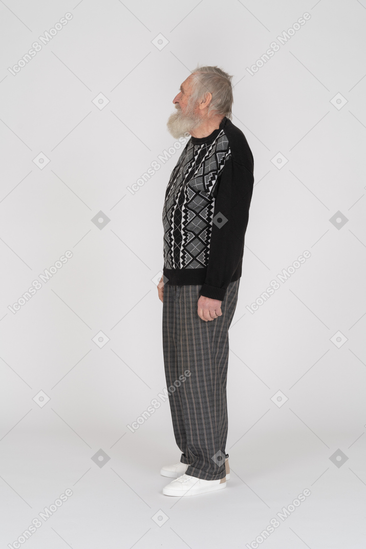Side view of an elderly man looking up