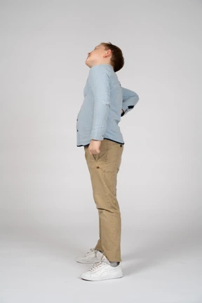 Side view of a boy stretching
