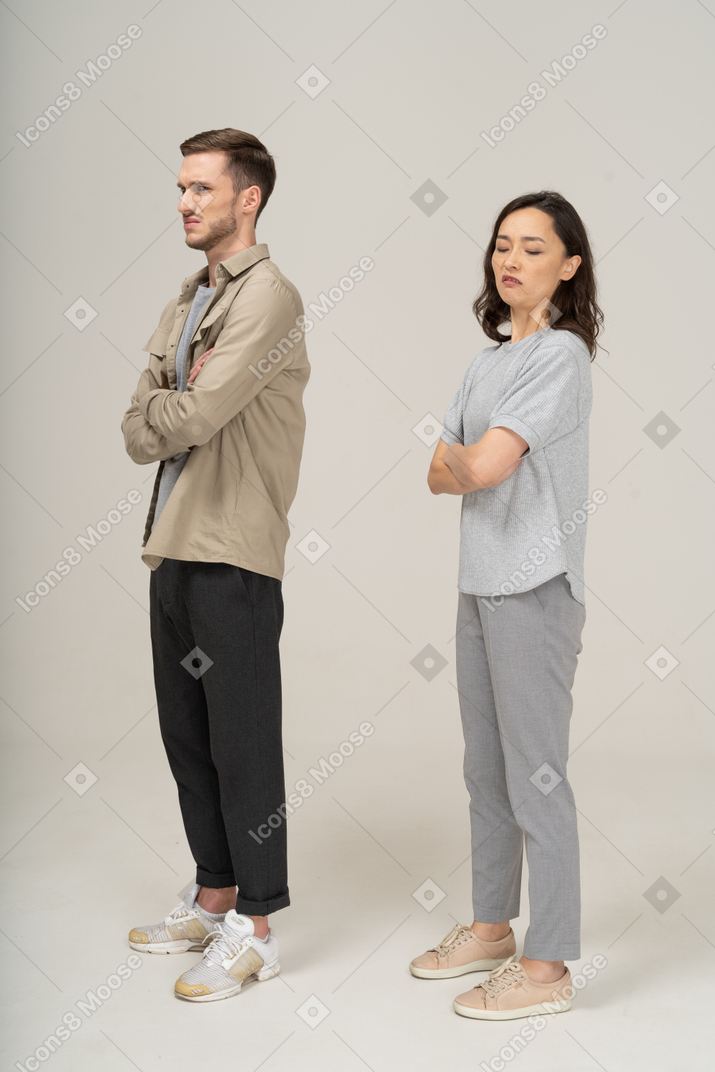 Three-quarter view of young couple being squeamish