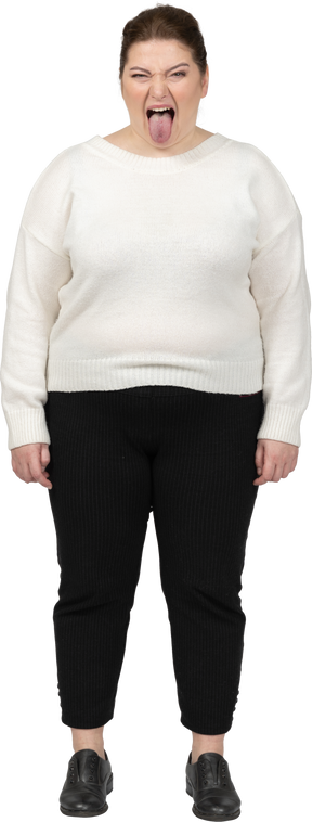 Angry plump woman in casual clothes looking at camera