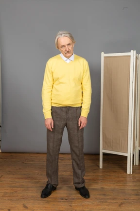 Front view of a serious old man looking at camera