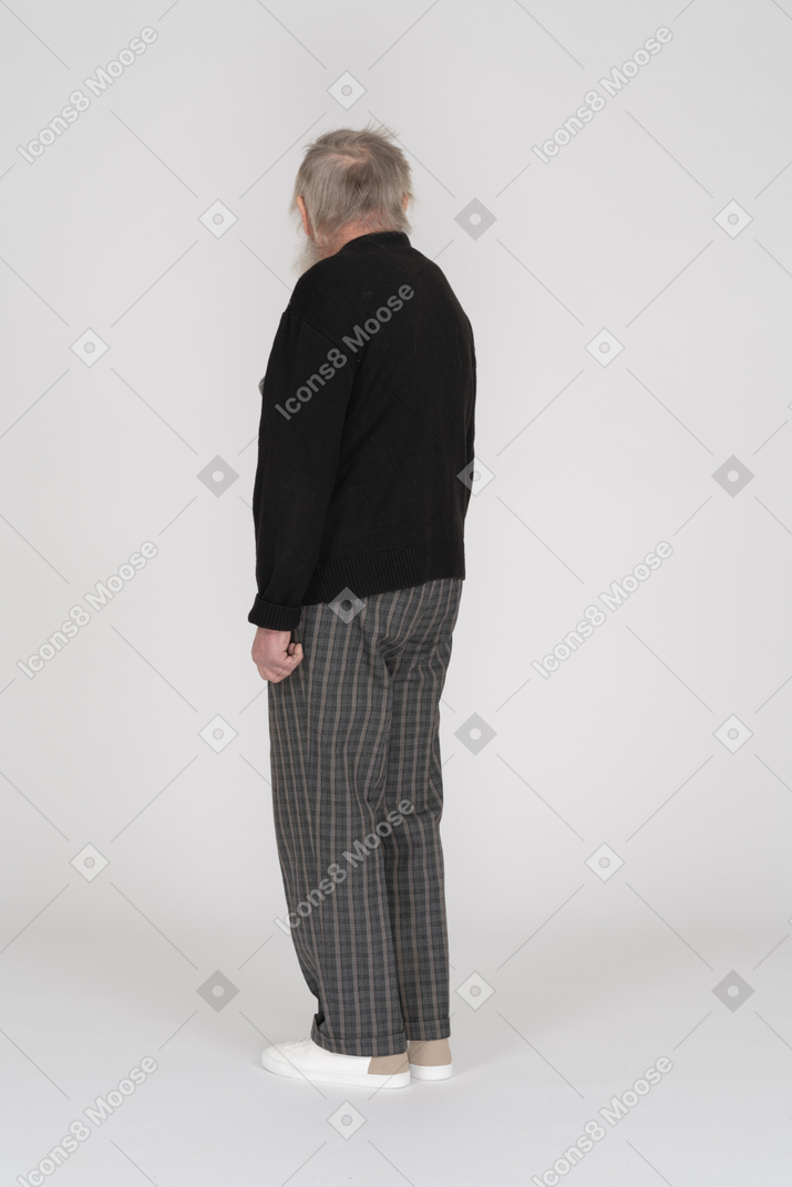 Three quarter back view of an old man turning away