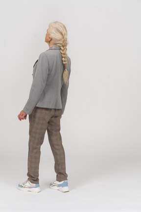 Back view of an old lady in suit