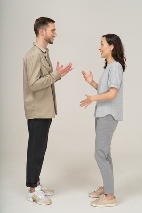 Side view of young couple speaking to each other