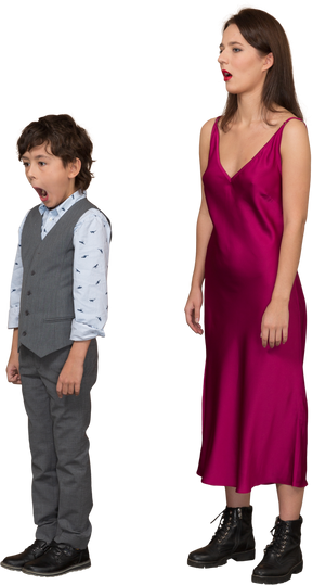 Sleepy woman in red dress and boy in grey suit vest