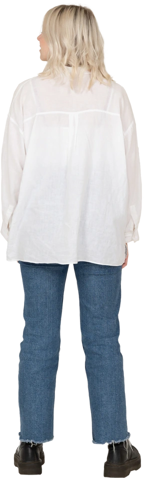 Back view of a blonde female in casual clothes looking aside