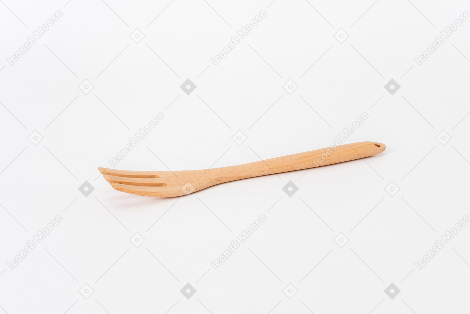 Wooden fork on white background shot from the side