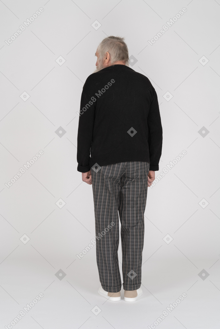Back view of an old man turning head