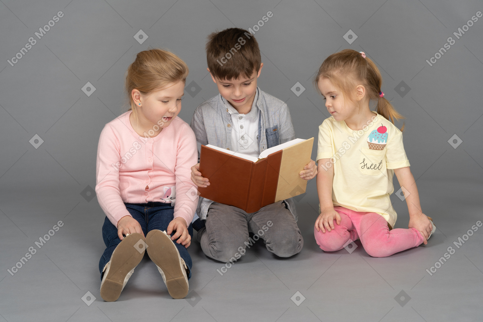 Little boy reading for his friends