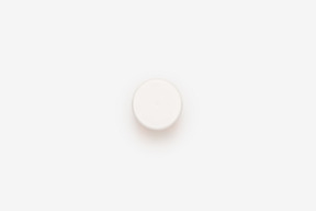 Bottom of white plastic pill bottle