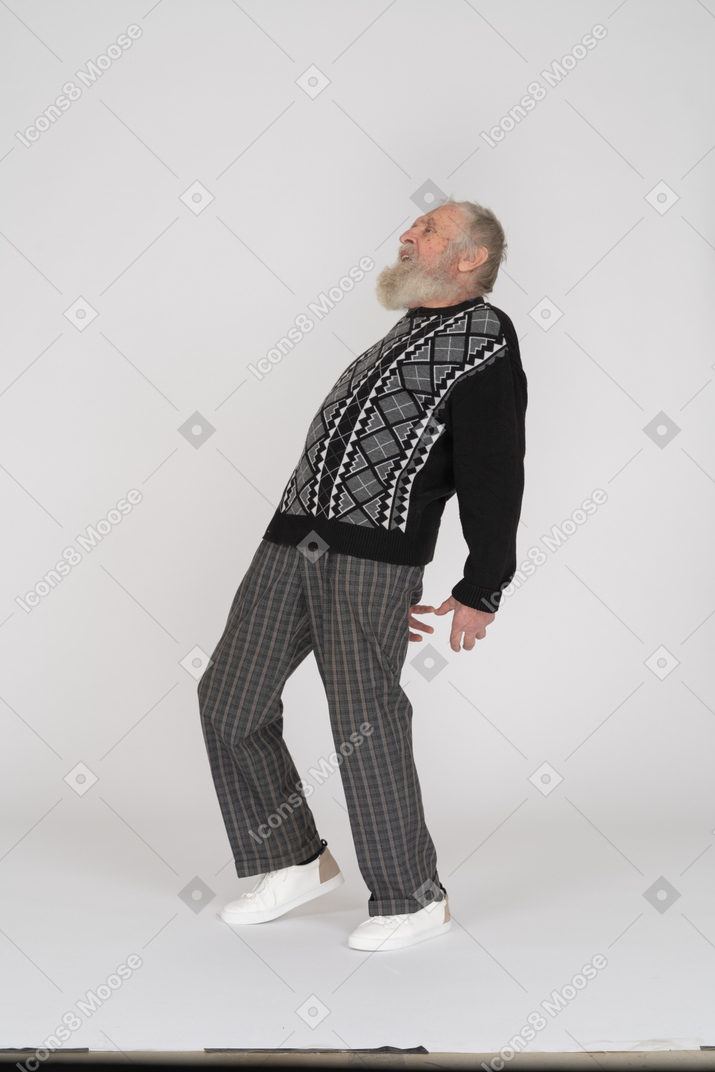 Old man bending backwards