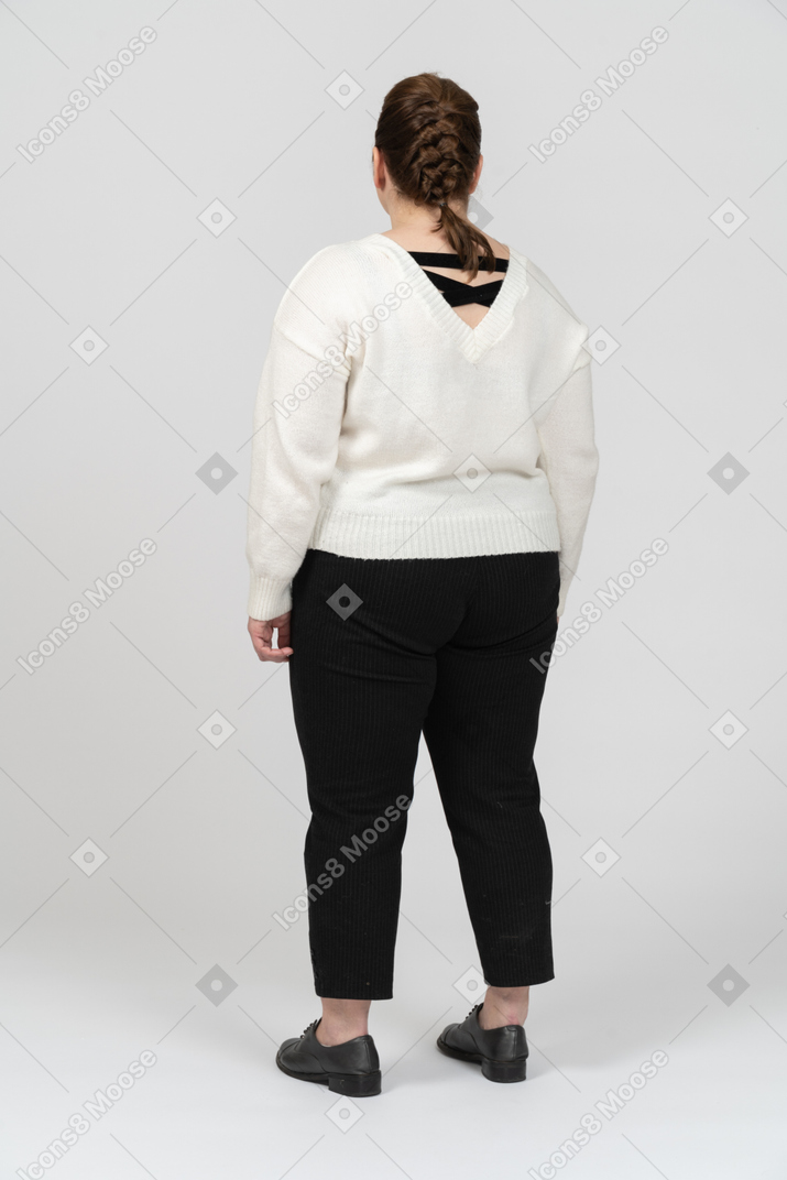 Plump woman in casual clothes standing