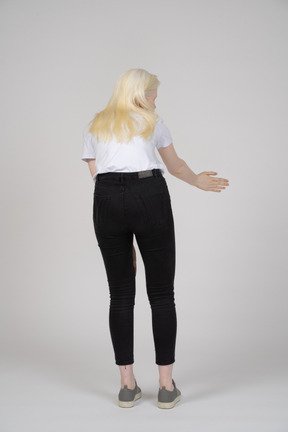 Back view of a woman bending forward and gesturing