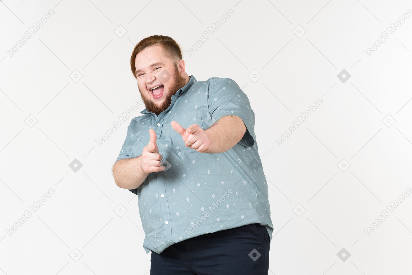Laughing young overweight man pointing forward