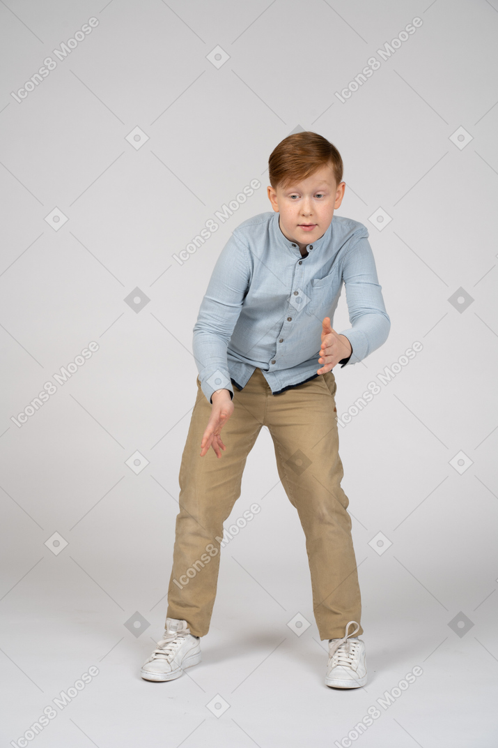Young boy doing robot arms dance
