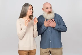 Elegant senior couple looking scared