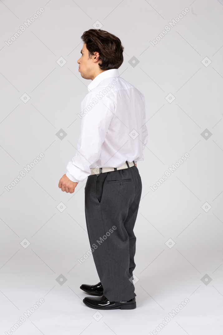 Man in business casual clothes looking away