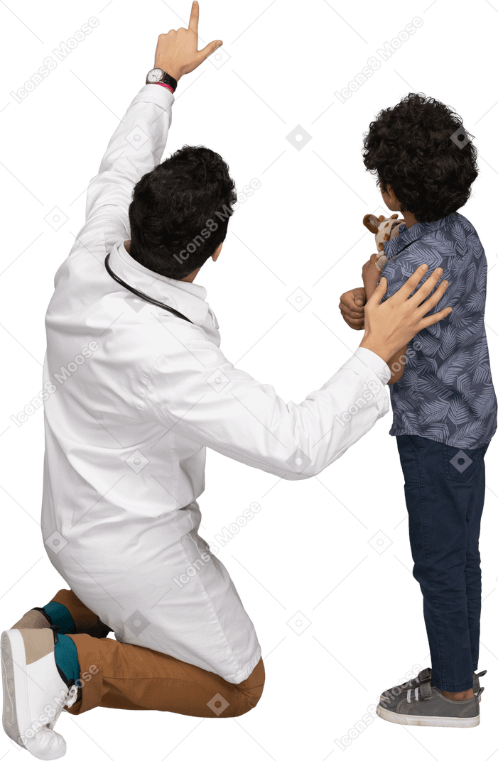 Doctor showing something to boy