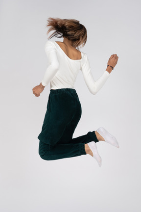 Woman in casual clothes jumping