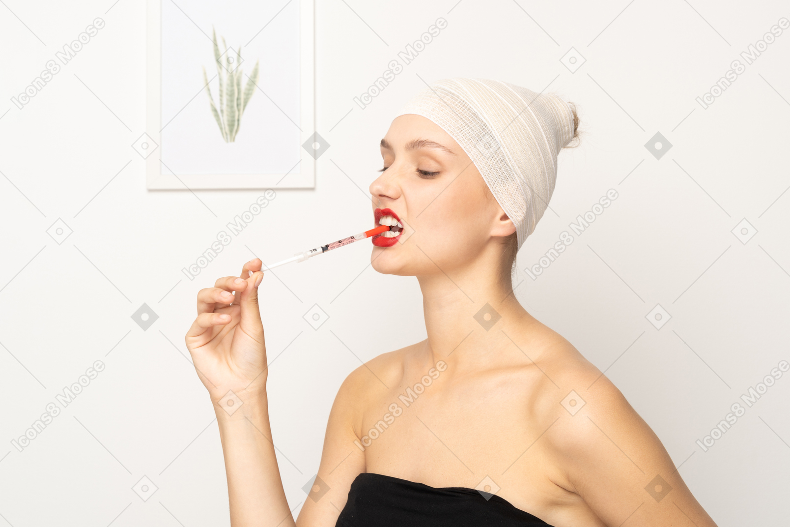 Portrait of a young woman biting syringe