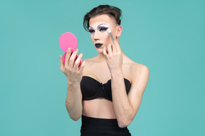 Drag queen putting on make up