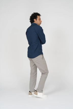Man in casual clothes posing in profile