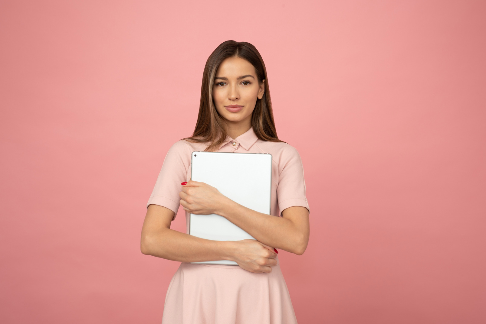 Young beautiful woman holding a laptop