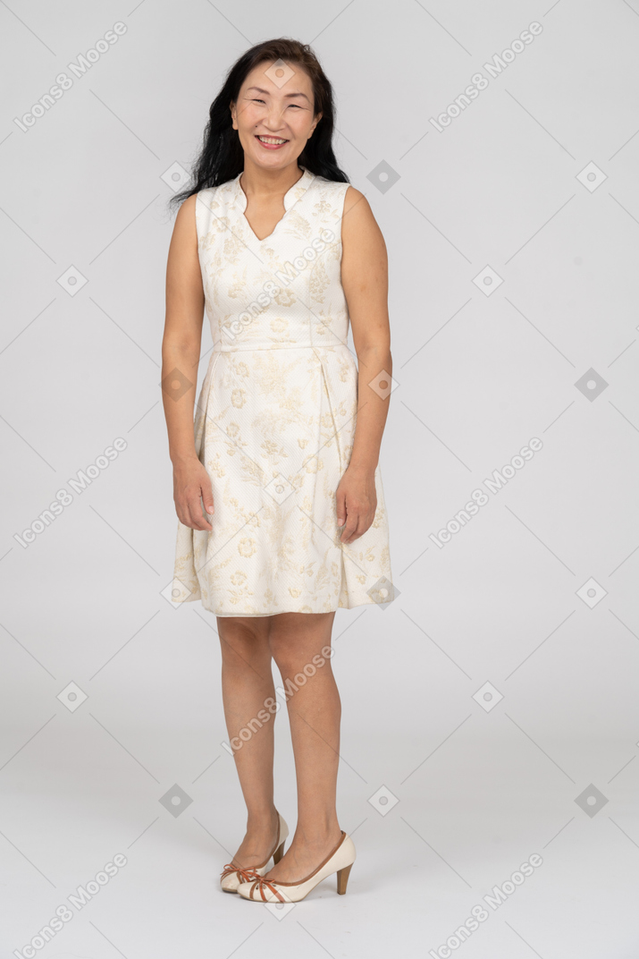 Woman in a white dress standing
